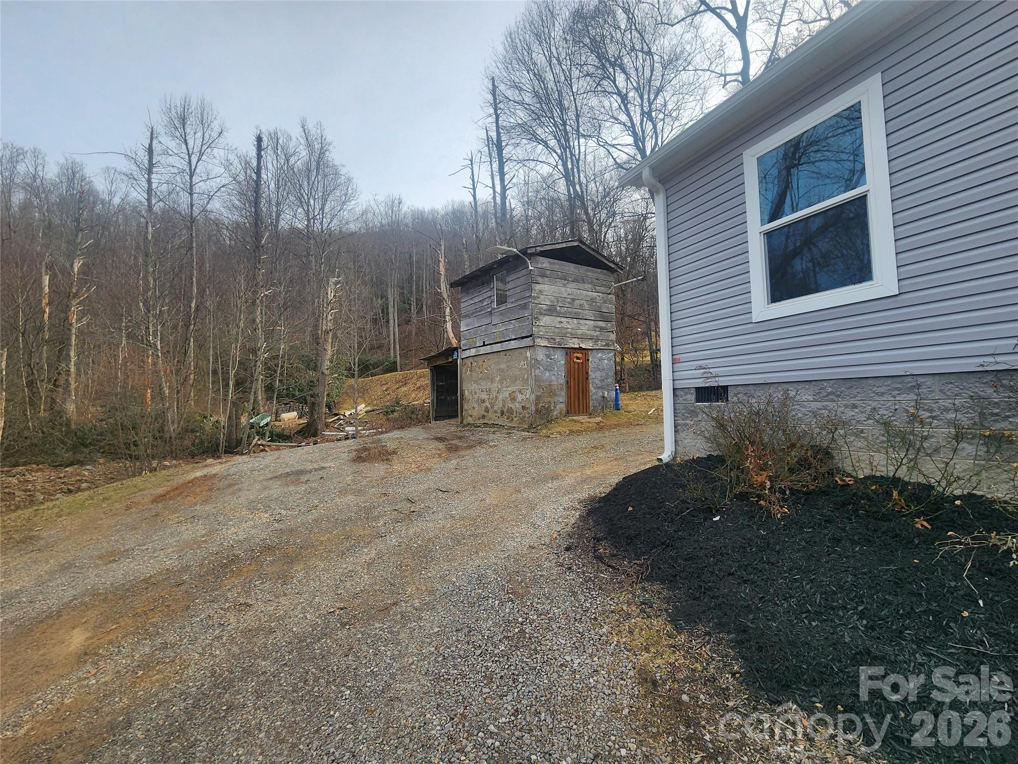 659 Cold Creek Road Canton, NC 28716 - Photo 9 of 37 a backyard of a house with lots of green space