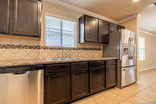 a view of a door and a window