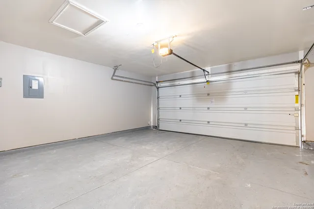a view of a kitchen with a sink and cabinets