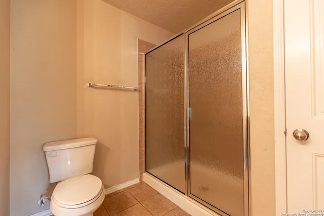 a view of a two chairs in the balcony