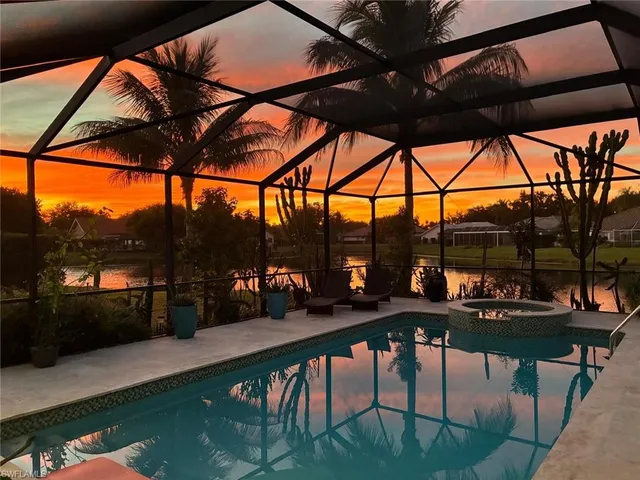 a view of swimming pool with outdoor seating