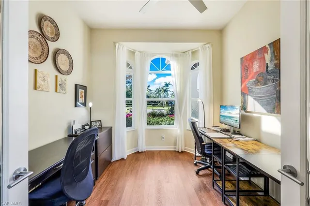 a workspace with furniture and window