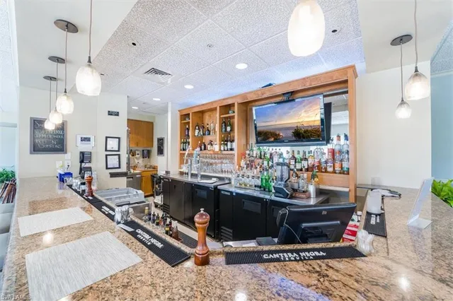 a living room with fireplace furniture and a flat screen tv