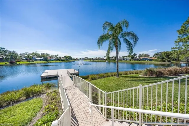 a view of a lake with houses in the background