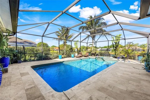 a view of a backyard with a small swimming pool