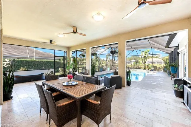 a view of a dining room with furniture window and outside view