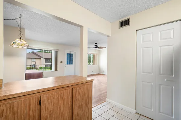 a view of a kitchen with granite countertop cabinets