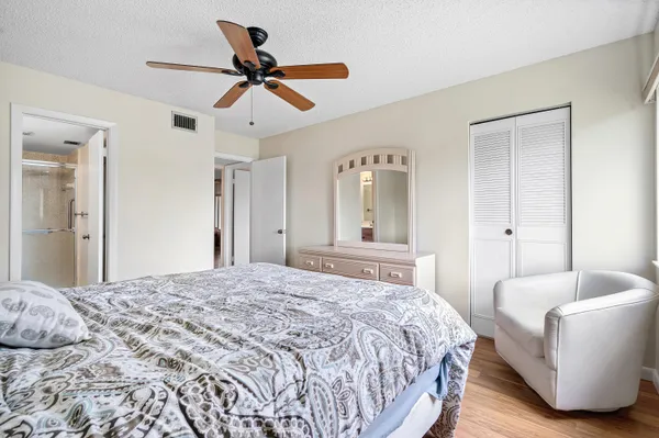 a bedroom with a bed and a couch