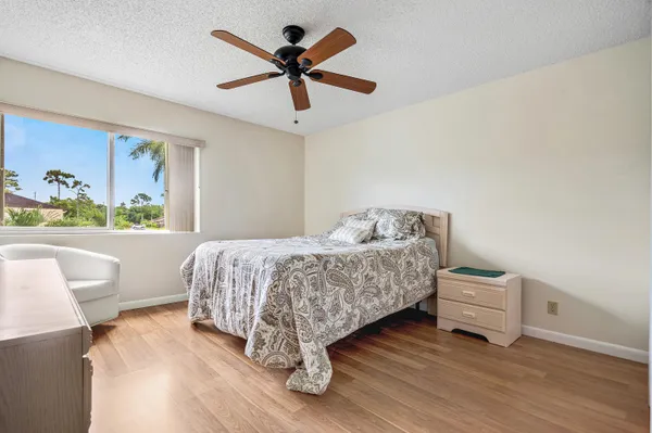 a living room with a bed furniture and a window