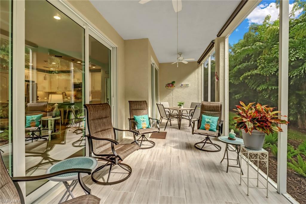 6959 Avalon Circle, Unit 1704 Naples, FL 34112 - Photo 23 of 25 a view of a dinning room with furniture and floor to ceiling window