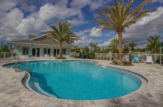 6959 Avalon Circle, Unit 1704 Naples, FL 34112 - Photo 24 of 25 a view of a house with pool
