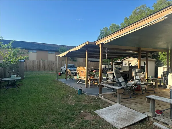 a view of a backyard with a patio