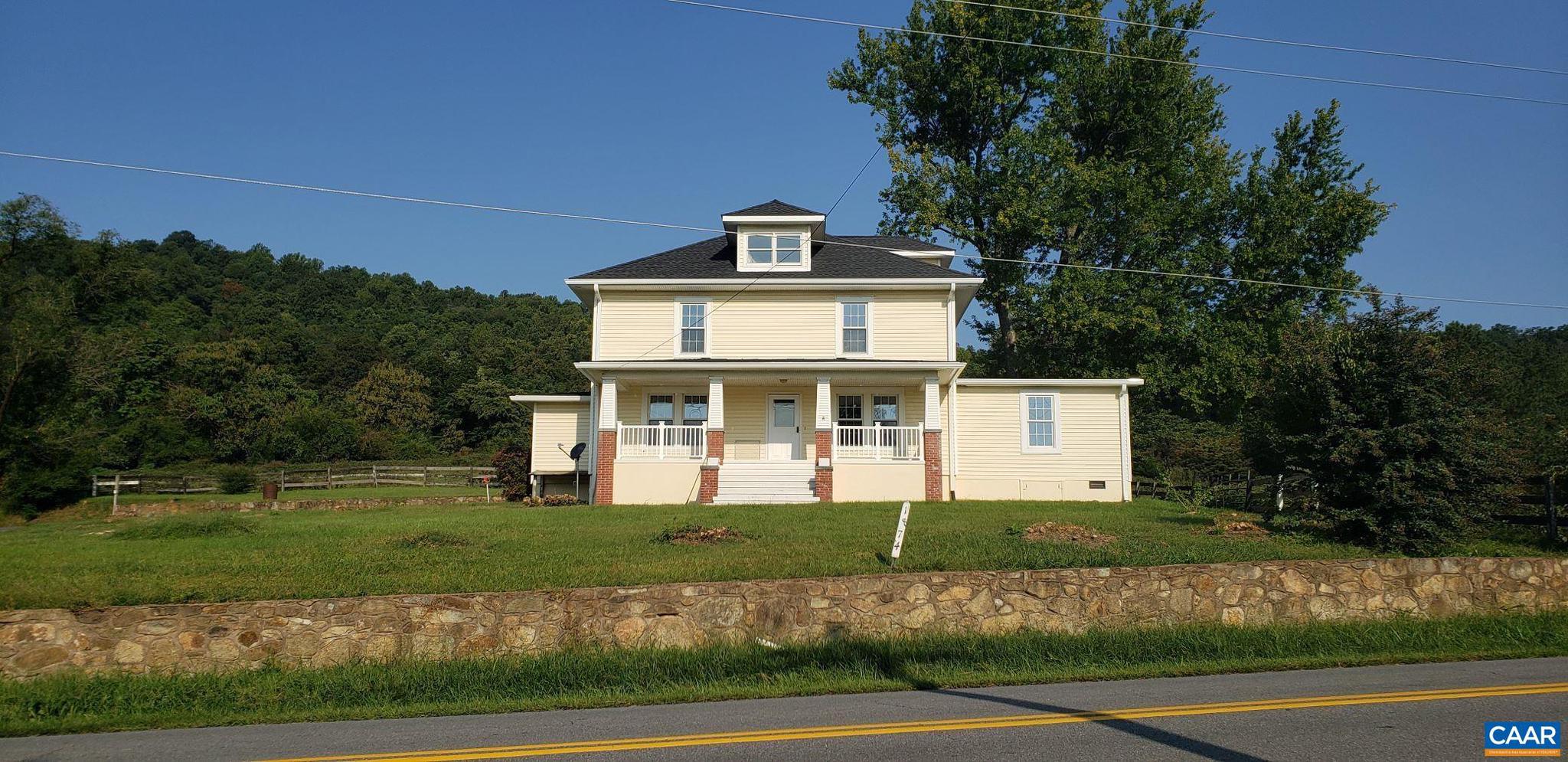 1874 White Hall Road Crozet, VA 22932 - Photo 1 of 39 a front view of a house with a yard