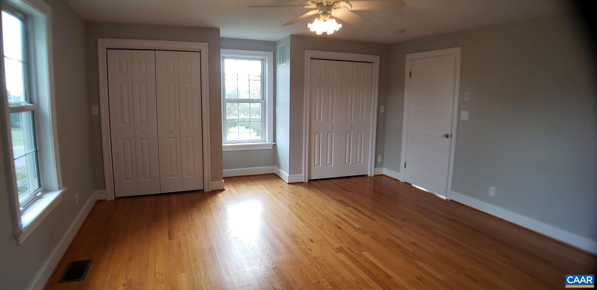 1874 White Hall Road Crozet, VA 22932 - Photo 18 of 39 an empty room with wooden floor and windows