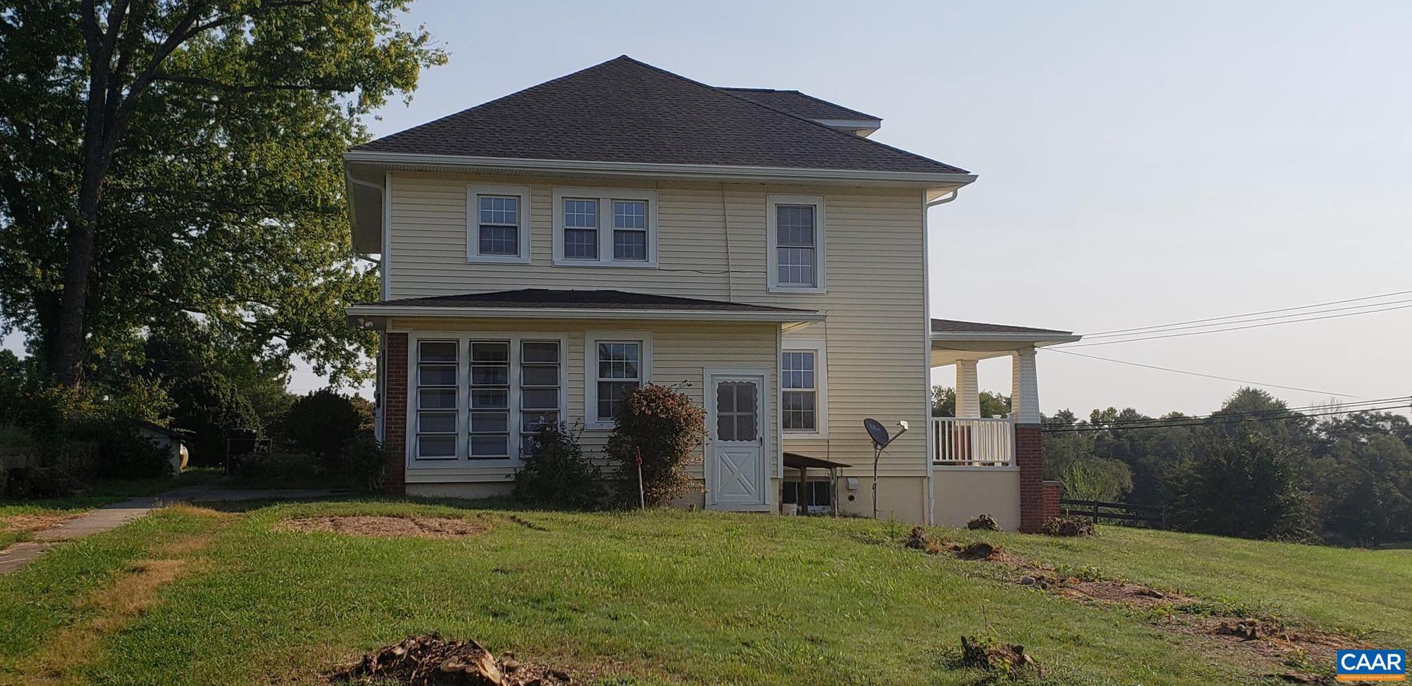 1874 White Hall Road Crozet, VA 22932 - Photo 2 of 39 a front view of a house with a yard