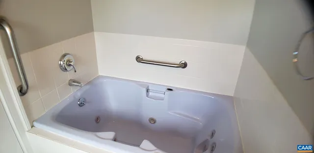 a bathroom with a toilet sink and tub