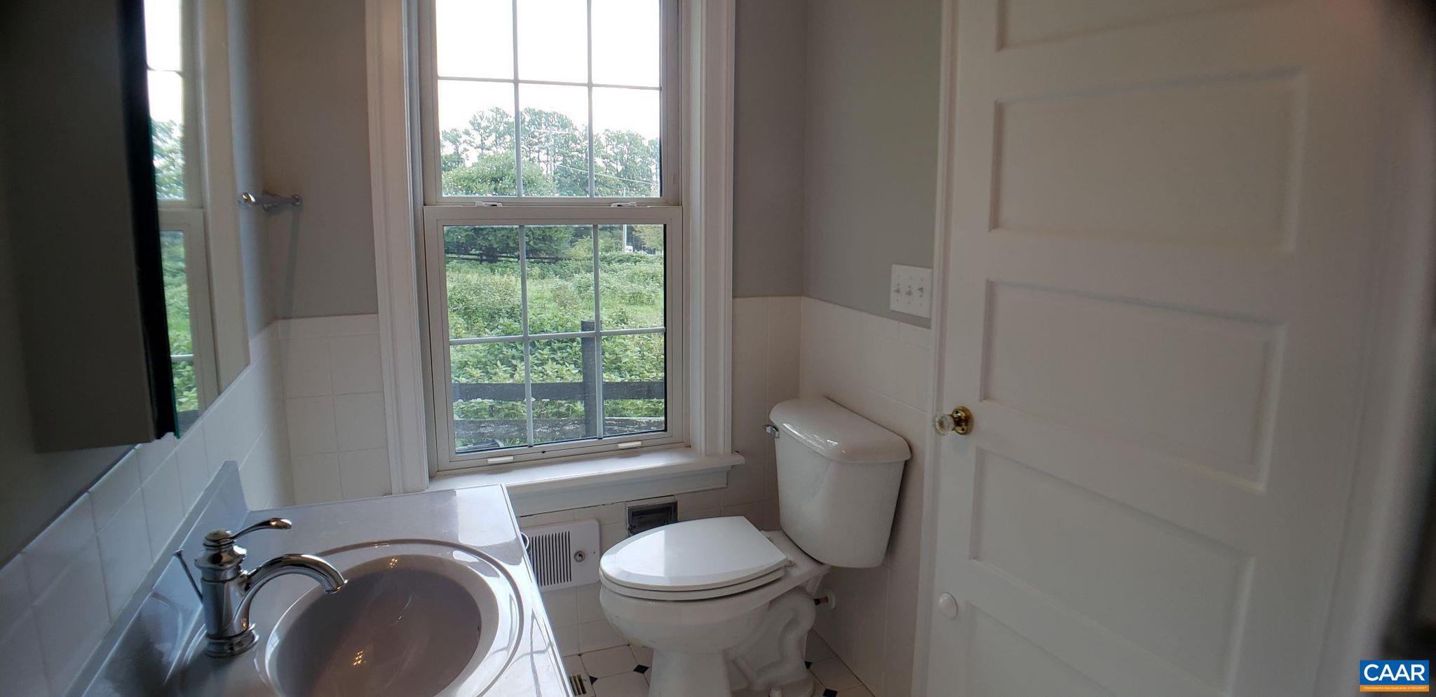 1874 White Hall Road Crozet, VA 22932 - Photo 22 of 39 a bathroom with a toilet sink and tub