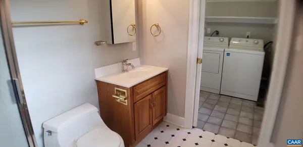 a view of a room that has a bed and a window