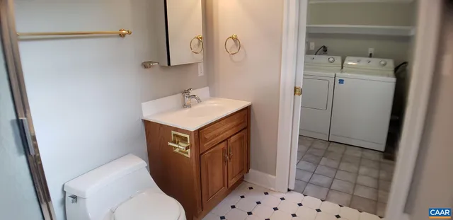 a view of a room that has a bed and a window