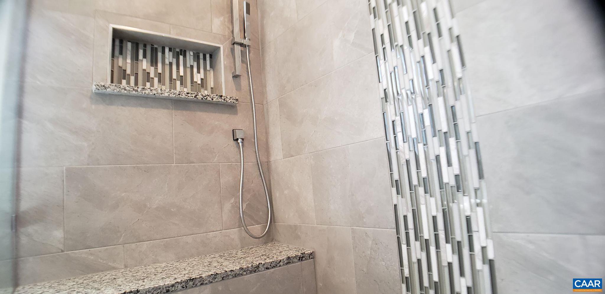 1874 White Hall Road Crozet, VA 22932 - Photo 36 of 39 a bathroom with a granite countertop shower and a sink