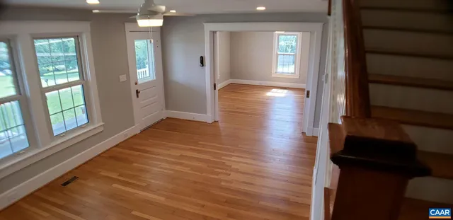 a room with furniture and a book shelf