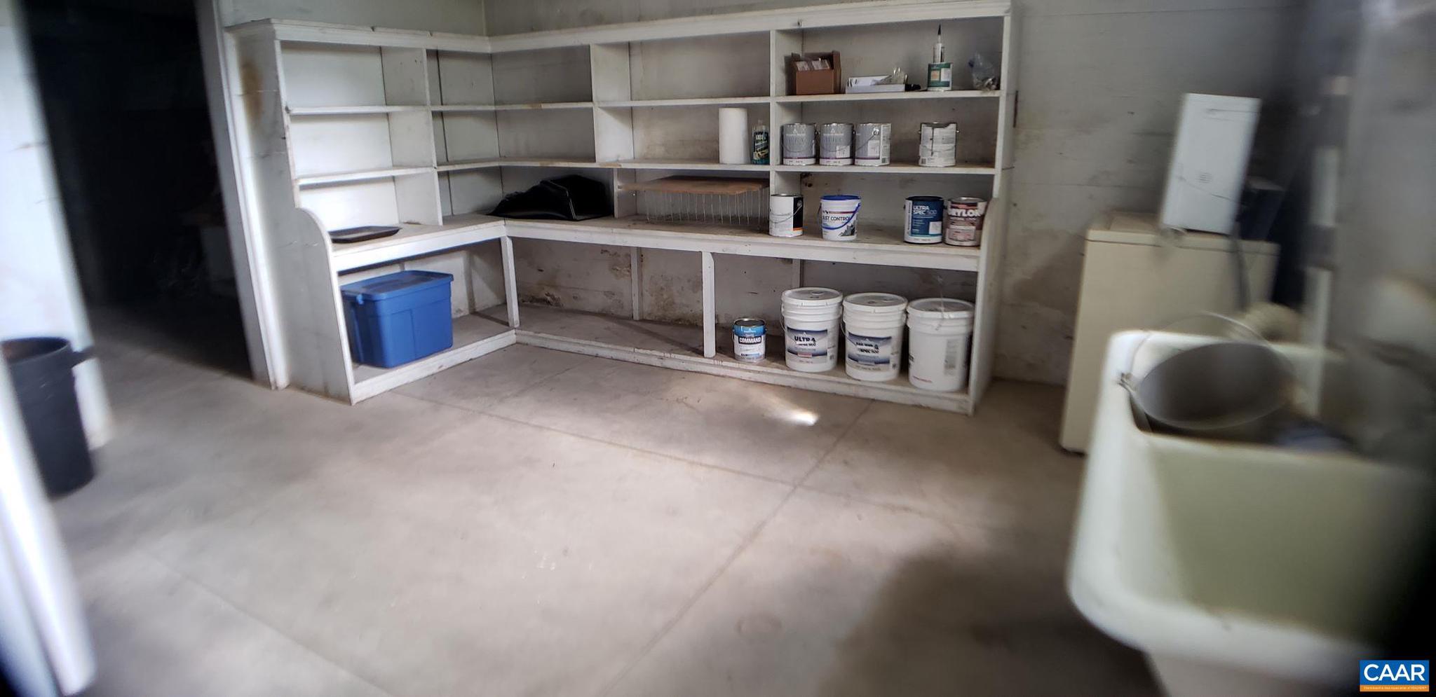 1874 White Hall Road Crozet, VA 22932 - Photo 38 of 39 a room with furniture and a book shelf