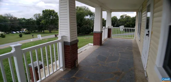 a view of a porch with a yard
