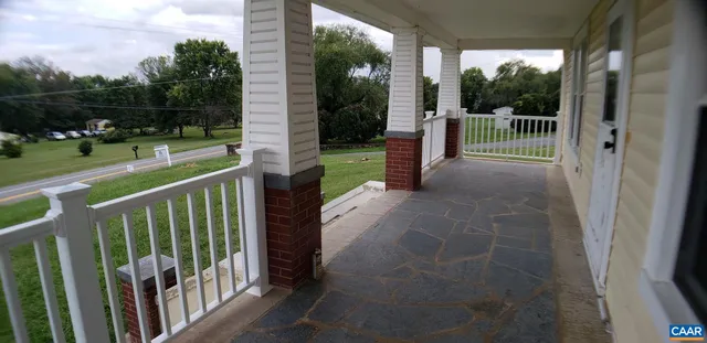 a view of a porch with a yard