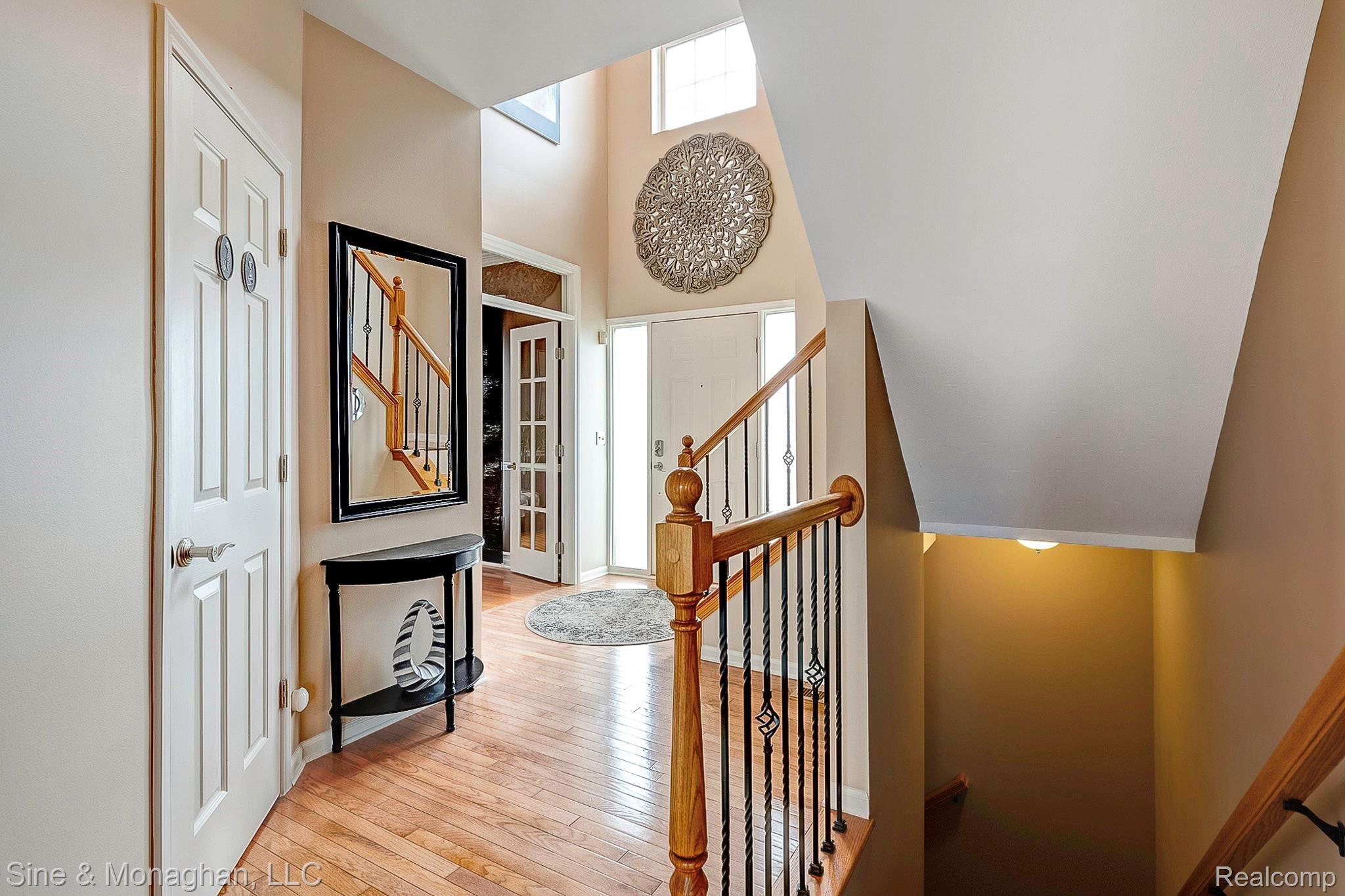 3248 Wren Lane Rochester, MI 48309 - Photo 5 of 65 Foyer with wrought iron spindles for upper and lower levels
