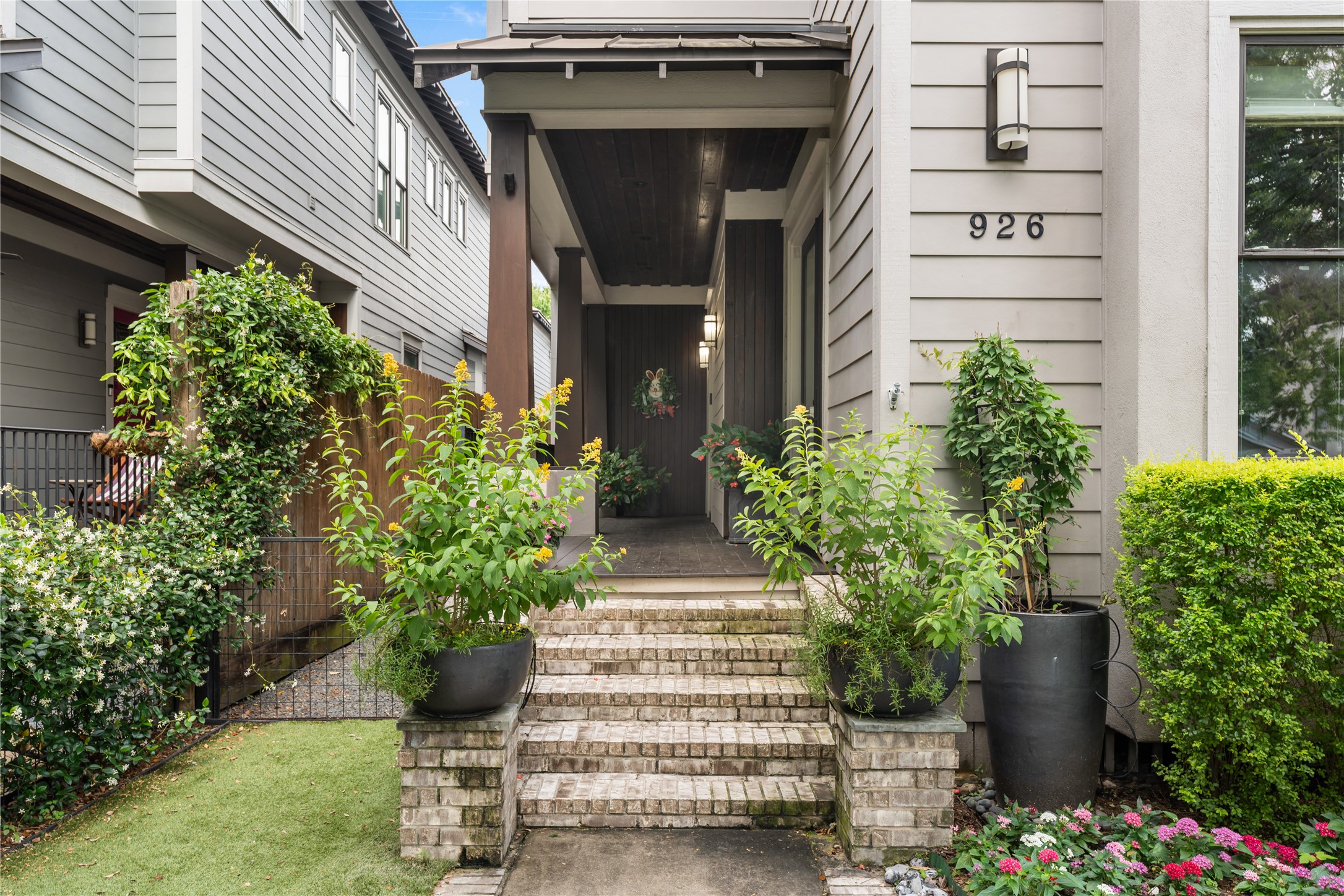 926 Nicholson Street Houston, TX 77008 - Photo 3 of 36 Expansive covered front porch offers a welcoming introduction to the home for guests. For you, morning coffee, evening walks, and miles of trail access begin just beyond your front door.