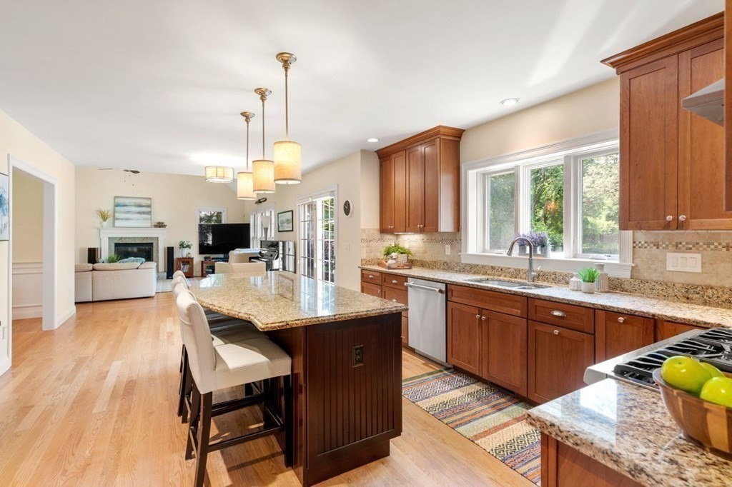 1 Hawes Road Sudbury, MA 01776 - Photo 11 of 38 a kitchen with stainless steel appliances granite countertop a sink dishwasher a stove and a refrigerator with wooden floor