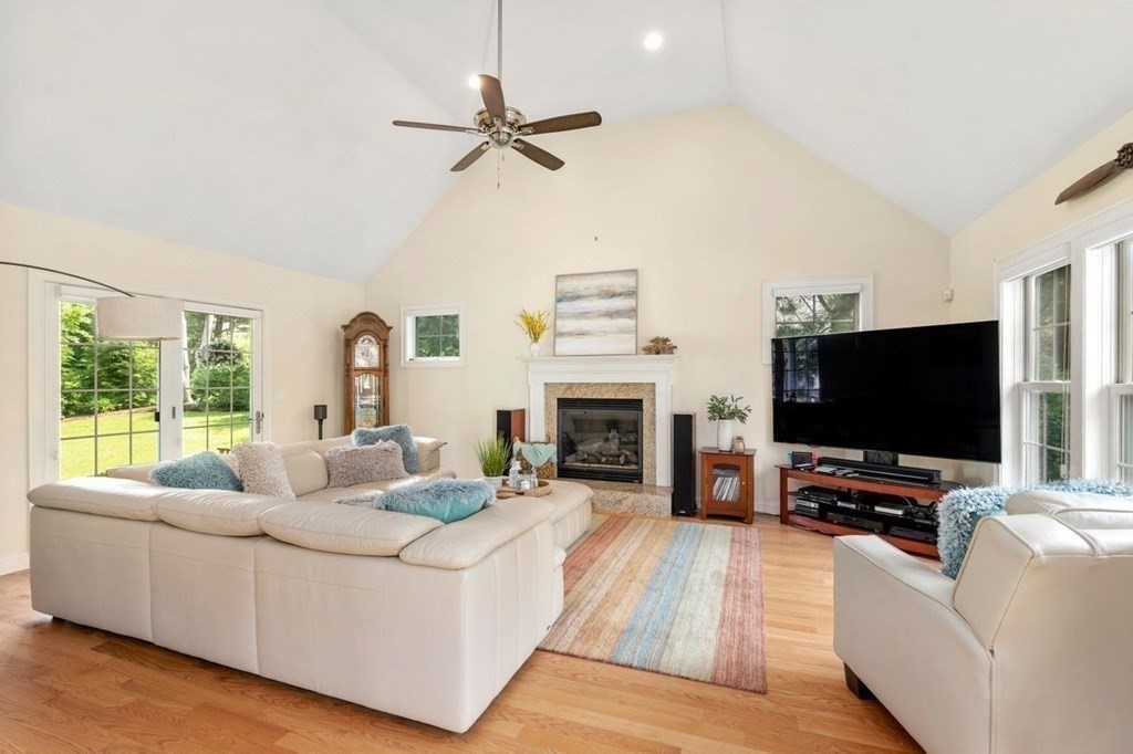 1 Hawes Road Sudbury, MA 01776 - Photo 13 of 38 a living room with furniture and a flat screen tv
