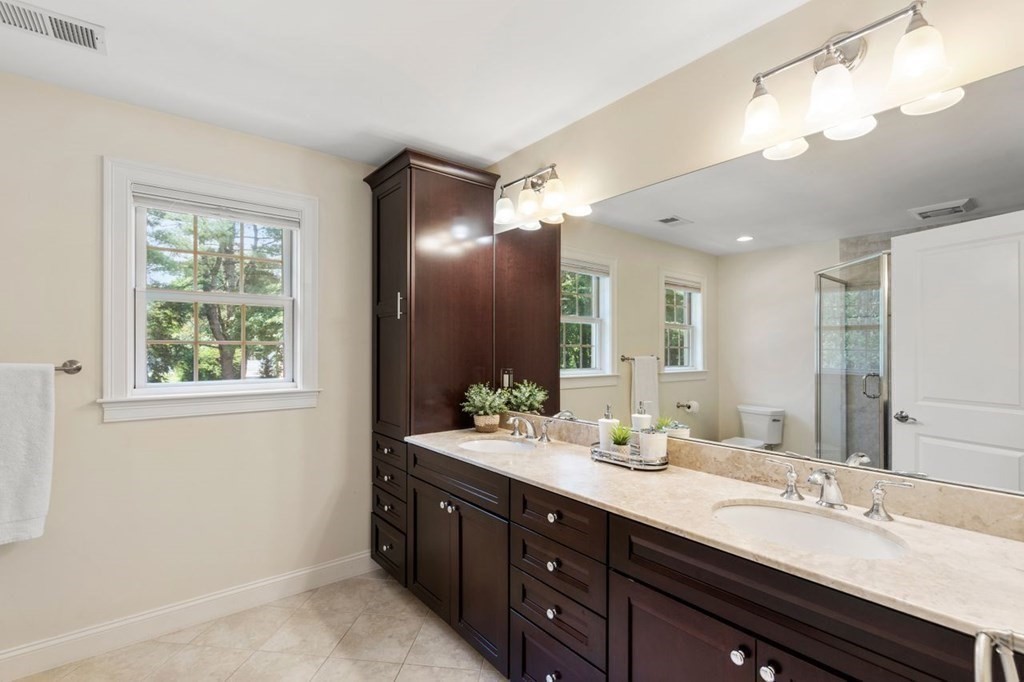 1 Hawes Road Sudbury, MA 01776 - Photo 20 of 38 a bathroom with a double vanity sink and a mirror