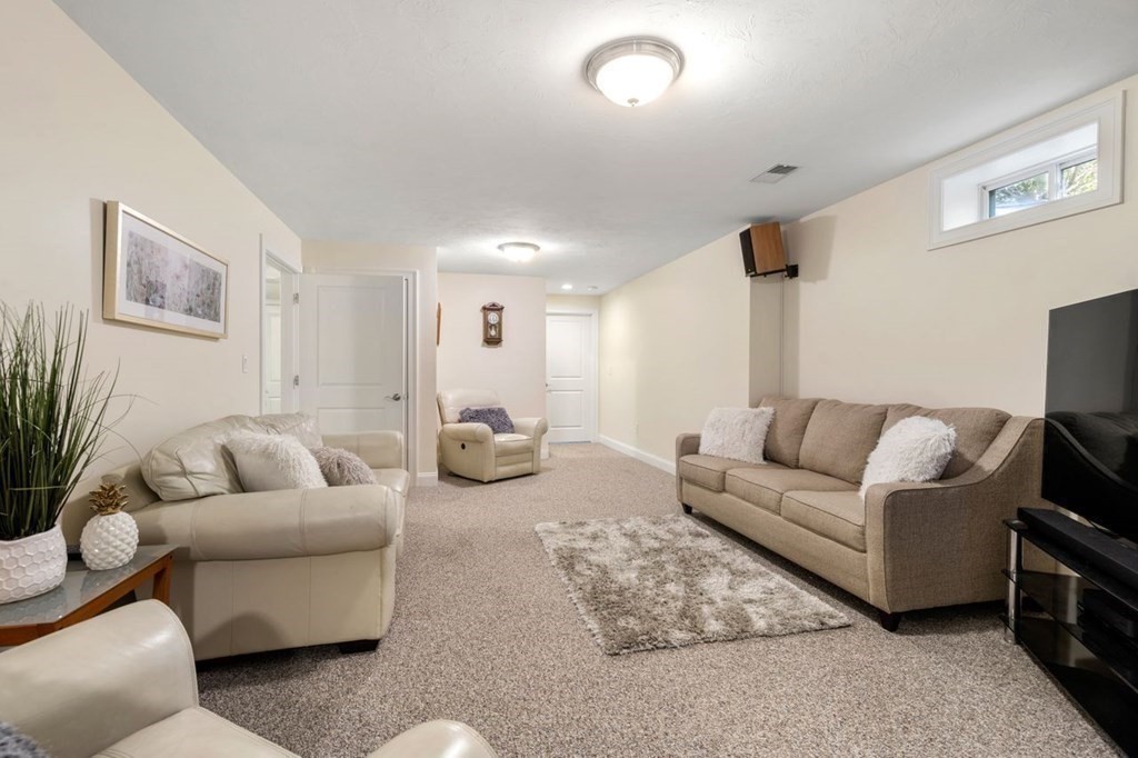 1 Hawes Road Sudbury, MA 01776 - Photo 25 of 38 a living room with furniture and a couch