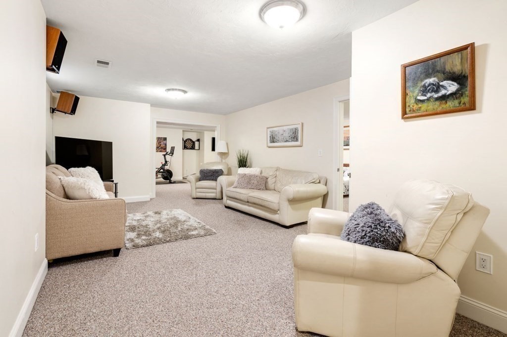1 Hawes Road Sudbury, MA 01776 - Photo 26 of 38 a living room with furniture and a couch