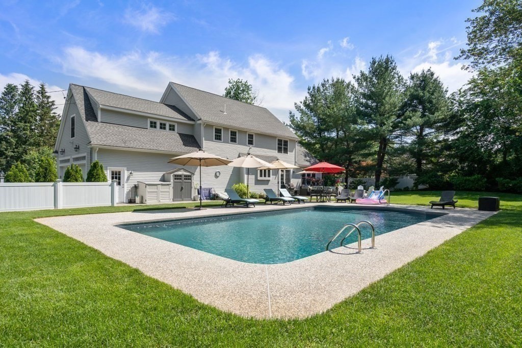 1 Hawes Road Sudbury, MA 01776 - Photo 3 of 38 a view of a house with swimming pool and yard