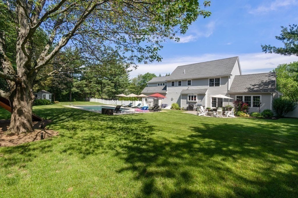 1 Hawes Road Sudbury, MA 01776 - Photo 36 of 38 a aerial view of a house with a yard table and chairs