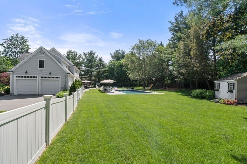 1 Hawes Road Sudbury, MA 01776 - Photo 37 of 38 a view of a house with a yard