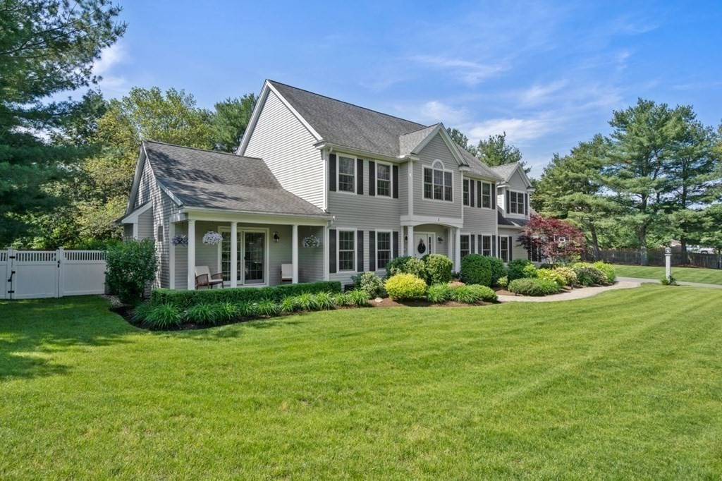 1 Hawes Road Sudbury, MA 01776 - Photo 4 of 38 a front view of a house with a yard