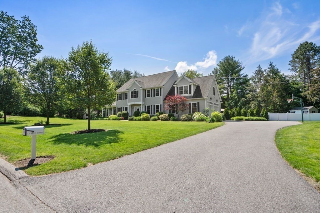 1 Hawes Road Sudbury, MA 01776 - Photo 6 of 38 a front view of a house with a yard and potted plants