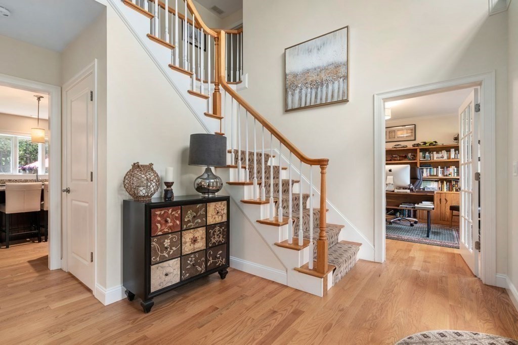 1 Hawes Road Sudbury, MA 01776 - Photo 8 of 38 a view of entryway dining room and hall with wooden floor