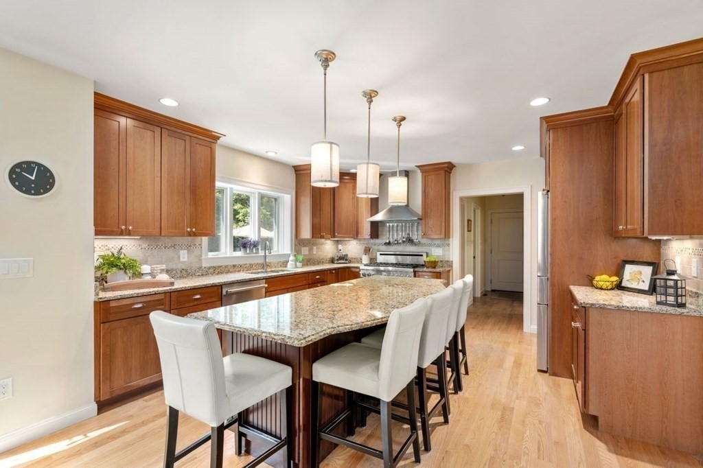 1 Hawes Road Sudbury, MA 01776 - Photo 9 of 38 a large kitchen with a table and chairs