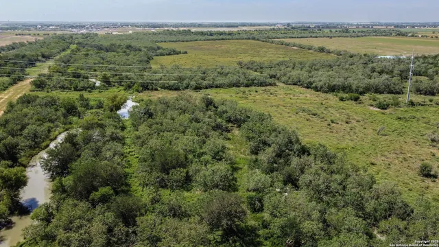 an aerial view of valley and lake