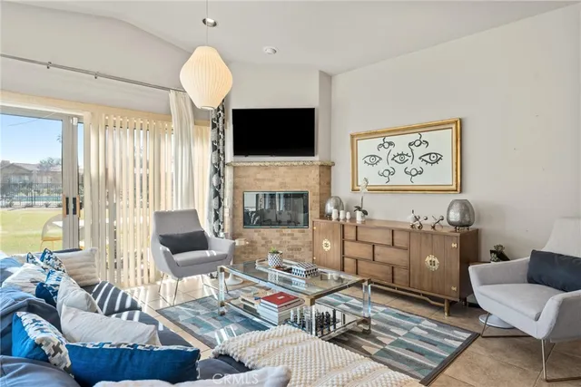 a living room with furniture fireplace and a flat screen tv