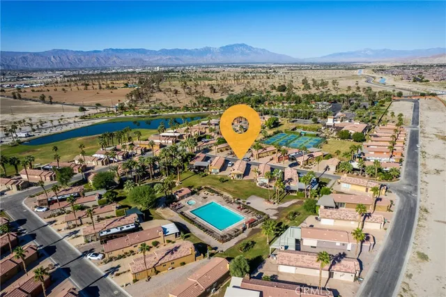 an aerial view of a city with ocean view
