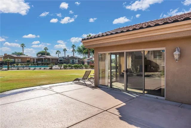 a view of a swimming pool with an outdoor space and seating area