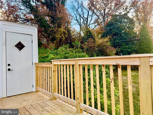 a balcony with view of trees in front of it