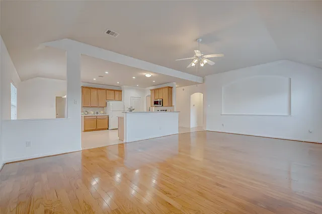 a view of a kitchen with a dishwasher cabinets and wooden floor