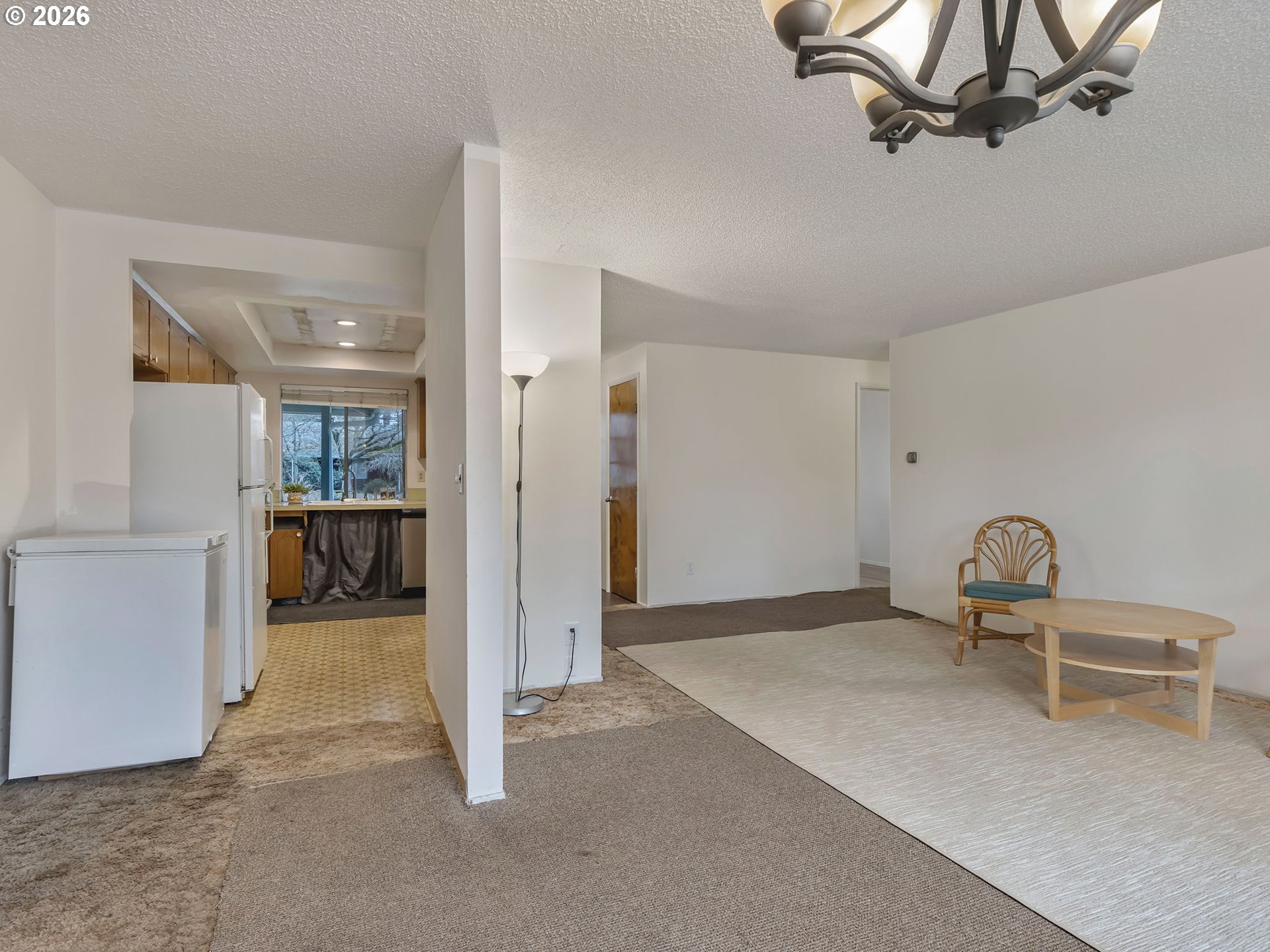 1033 Northeast 178th Avenue Portland, OR 97230 - Photo 11 of 29 a view of a livingroom with furniture and a chandelier fan