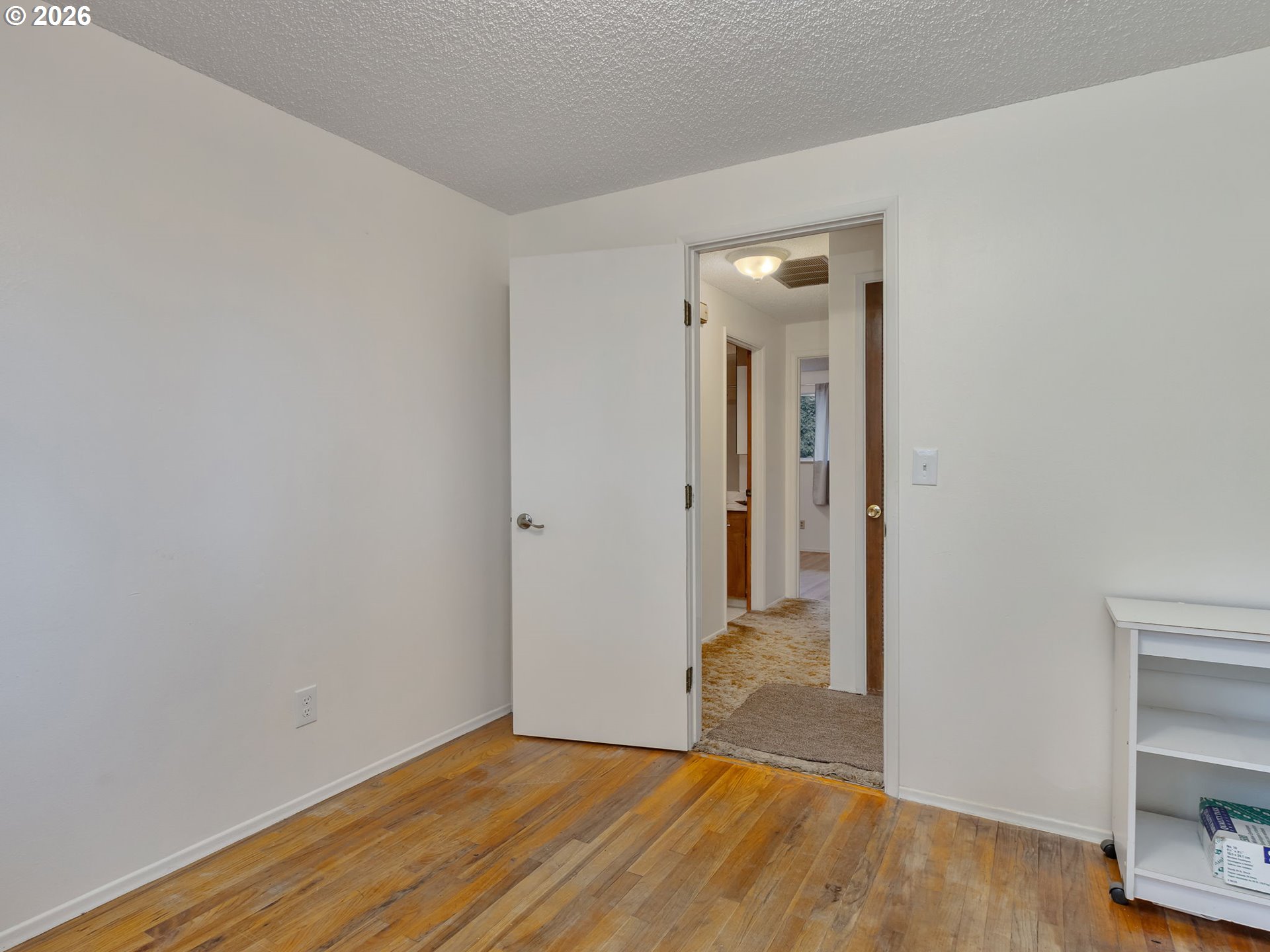 1033 Northeast 178th Avenue Portland, OR 97230 - Photo 18 of 29 a view of an empty room with wooden floor and closet